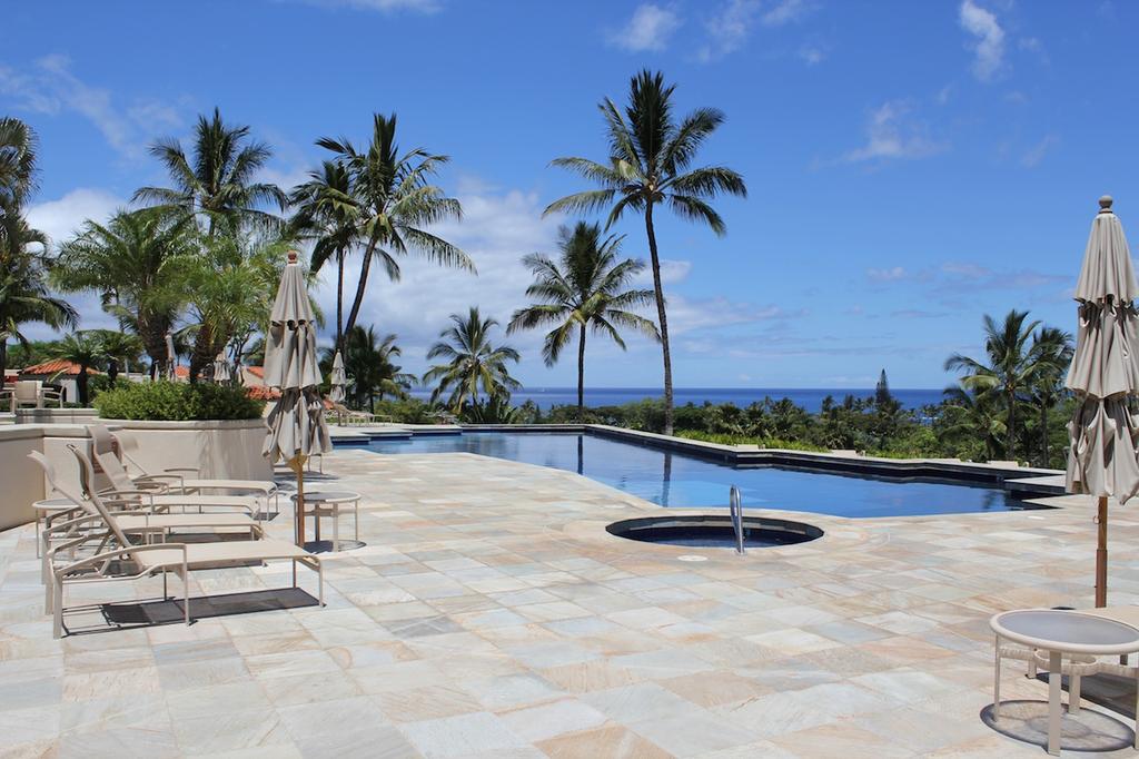 Large pool deck with pool and whirlpool spa