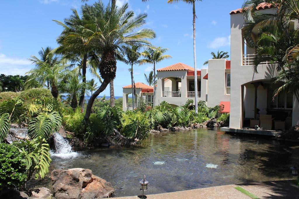 Small lake and waterfalls are landscaped into the property